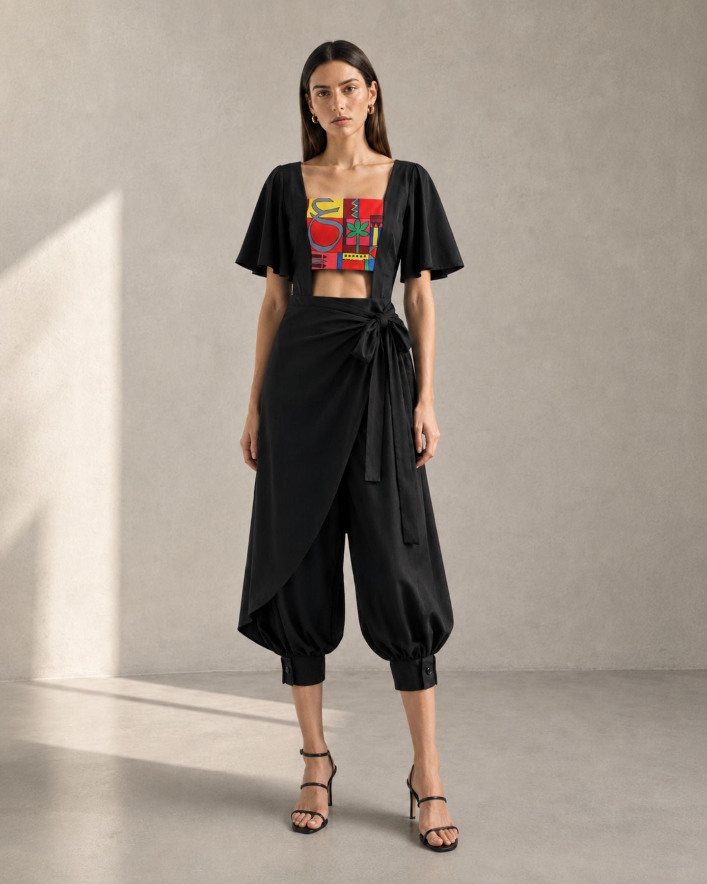 Moucharabieh Wrap Jumpsuit, detail of the buttoned cuff and gathering at the leg hem