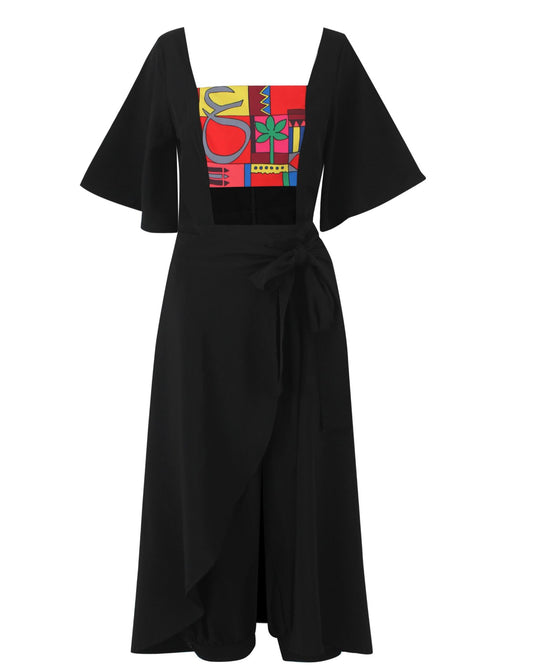 Moucharabieh Wrap Jumpsuit in black with printed bust panel, front view with wrap scarf skirt tied at the hip