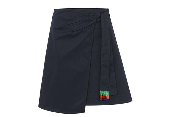 Navy blue Souk Wrap Micro Skirt with side-gathered tie and hand-beaded multi-coloured fringe sash from Bardees Zellij Drift collection.
