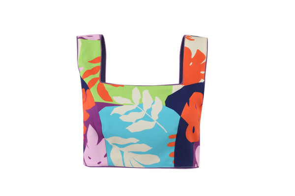 Structured square-neck crop top in multicolour tropical print with purple piping and back zip, product flat shot on white background.
