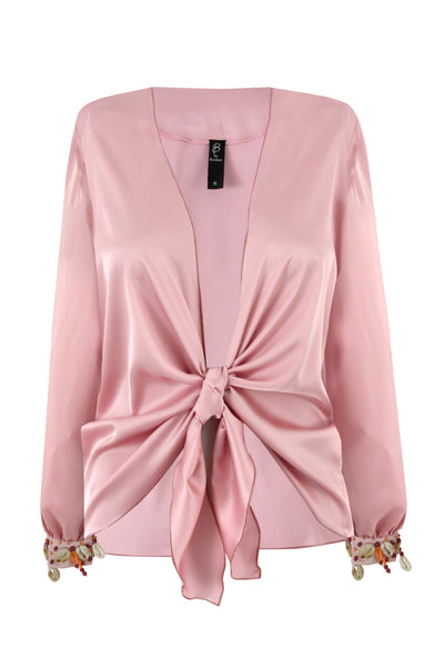 Pale rose Armani satin tie-front crop top with hand-applied shell and bead cuffs, worn with black wide-leg trousers — Bardees Riad Tie Crop (توب رياض).